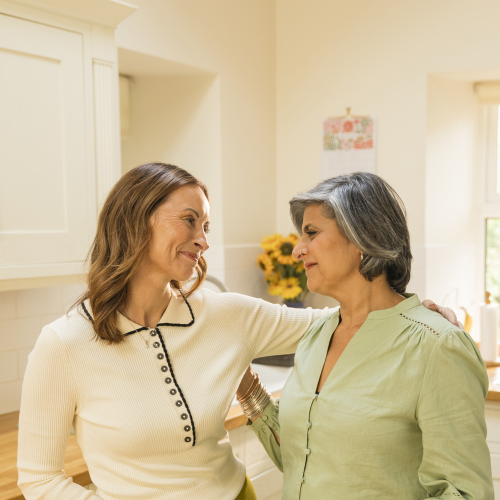 Image of two carents feeling supported in their journey of caring for an elderly parent