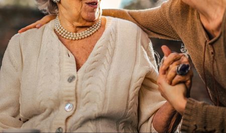 An elderly person speaking with their carent 