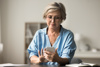 Carent accessing digital support services through her mobile phone
