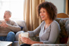A woman looking after her elderly parents sharing a coffee and telling her story 