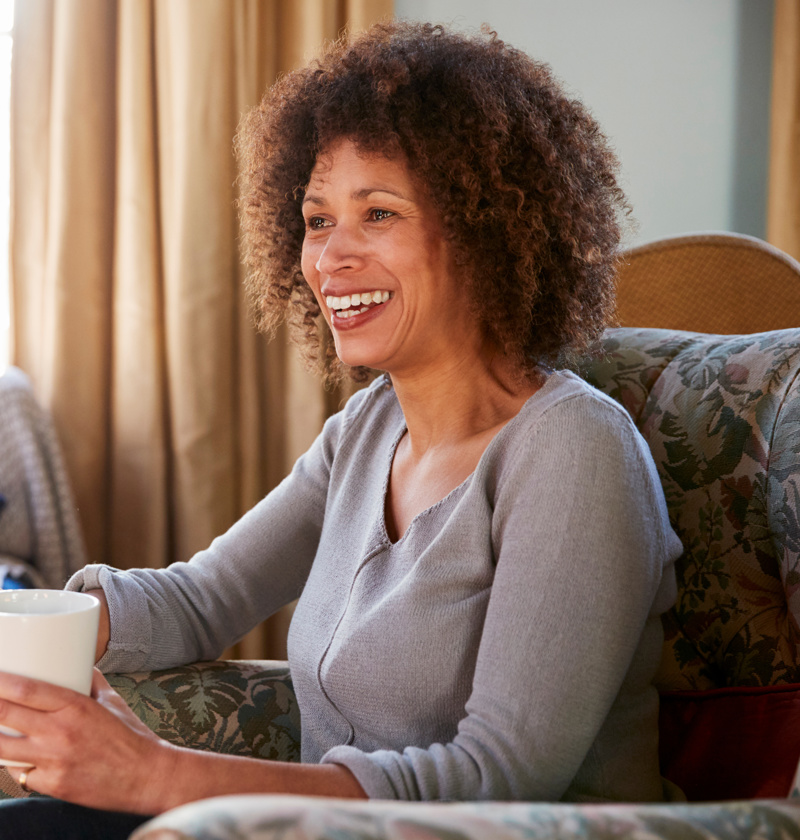 A woman looking after her elderly parents sharing a coffee and telling her story 