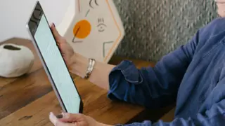 Older woman holding a tablet device