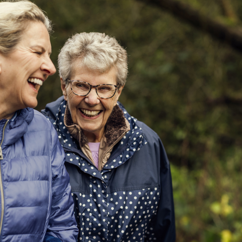 parent and carer walking outside 