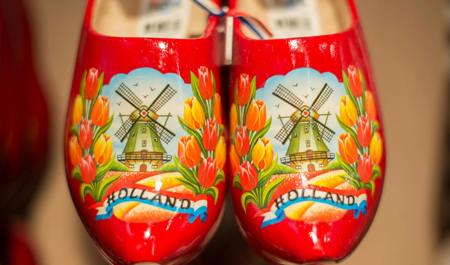 A pair of clogs with a windmill on.