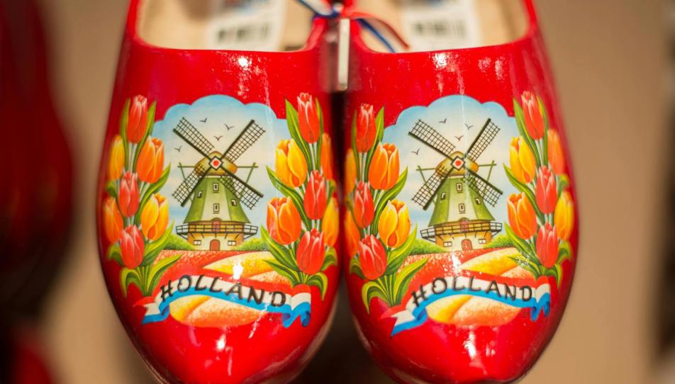 A pair of clogs with a windmill on.
