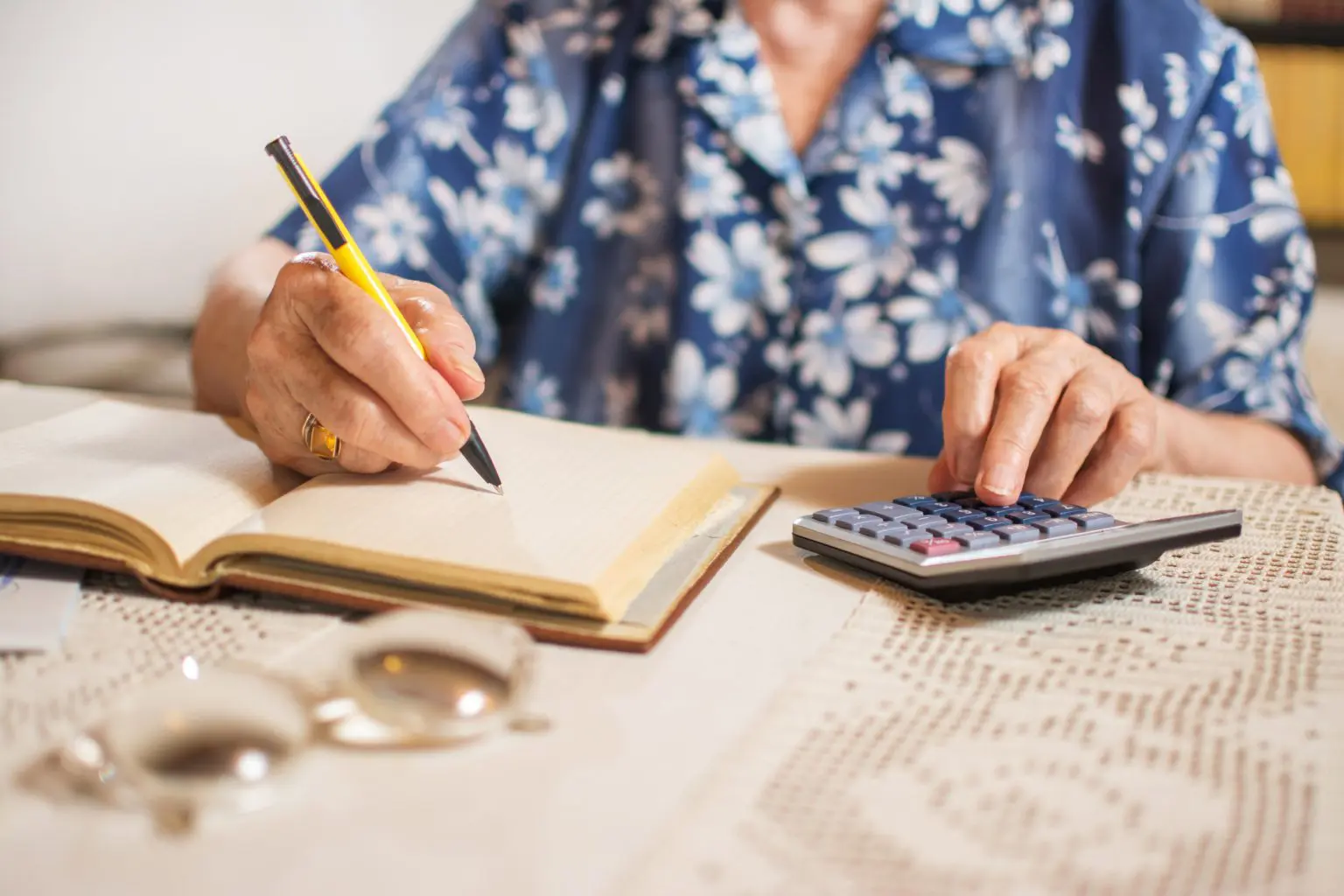 Middle-aged woman calculating finances