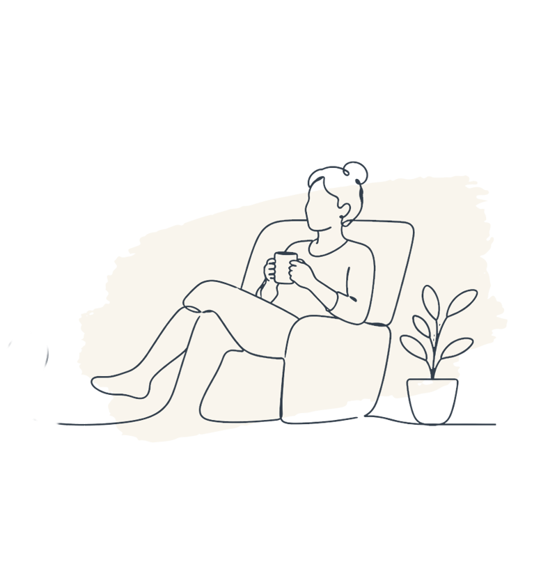 Woman sitting on sofa drinking tea 