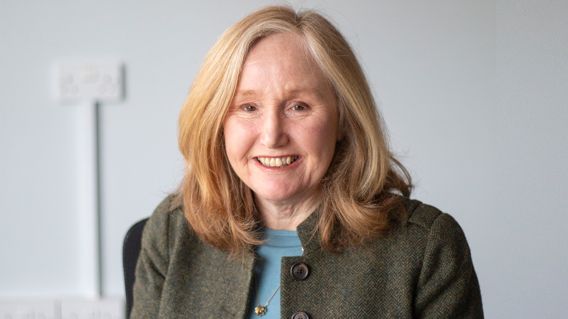 Dr Jackie Gray, founder of Carents, smiling during an interview about choosing a care home, as featured on BBC Radio